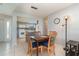 Open dining area with modern table, chairs, and easy access to the kitchen at 1423 Mediterranean Dr # C, Punta Gorda, FL 33950
