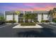 Well-maintained condo building featuring lush landscaping and convenient parking at 1423 Mediterranean Dr # C, Punta Gorda, FL 33950
