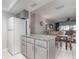 Bright kitchen open to the dining area, featuring granite countertops and modern appliances at 1423 Mediterranean Dr # C, Punta Gorda, FL 33950