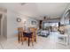 Bright living room featuring tile floors, comfortable seating, and sliding glass doors to the outside at 1423 Mediterranean Dr # C, Punta Gorda, FL 33950