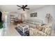 Cozy living room open to kitchen and dining area with comfortable seating at 1423 Mediterranean Dr # C, Punta Gorda, FL 33950