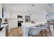Updated kitchen features stainless steel appliances, an island with bar seating, and ample counter space at 14325 Mcfarland Ave, Port Charlotte, FL 33981