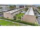 Aerial view of multi-unit condo buildings with central courtyard and palm trees at 150 Harborside Ave # 304, Punta Gorda, FL 33950