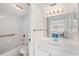 Bathroom with a shower/tub combination and large vanity, offering a seamless transition into a relaxing bedroom at 150 Harborside Ave # 304, Punta Gorda, FL 33950