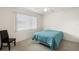 Comfortable bedroom with neutral carpet and a cozy chair by the window, creating a relaxing retreat at 150 Harborside Ave # 304, Punta Gorda, FL 33950