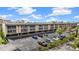 Exterior showcasing the building's facade, parking area, manicured landscaping, and convenient visitor parking at 150 Harborside Ave # 304, Punta Gorda, FL 33950