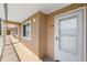 Exterior view of the condo showcasing unit 304 with neutral siding, window, and access to units at 150 Harborside Ave # 304, Punta Gorda, FL 33950