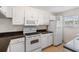 Bright kitchen featuring white cabinets, modern appliances, and stylish countertops at 150 Harborside Ave # 304, Punta Gorda, FL 33950
