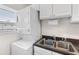 Functional laundry area with stacked washer and dryer, offering space-saving efficiency at 150 Harborside Ave # 304, Punta Gorda, FL 33950