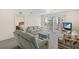 Inviting living room with comfortable furnishings, neutral colors, and access to exterior balcony at 150 Harborside Ave # 304, Punta Gorda, FL 33950