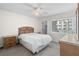 Bright bedroom featuring a large window, ample closet space, and neutral décor at 150 Harborside Ave # 304, Punta Gorda, FL 33950