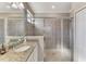 Bathroom featuring granite countertops and glass-enclosed shower at 15033 Spanish Point Dr, Port Charlotte, FL 33981