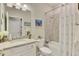 Functional bathroom featuring a granite countertop vanity, tiled shower, and essential fixtures at 15033 Spanish Point Dr, Port Charlotte, FL 33981