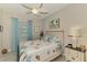Inviting bedroom with soothing decor, soft bedding, and a window, creating a relaxing atmosphere at 15033 Spanish Point Dr, Port Charlotte, FL 33981