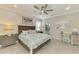 Bedroom featuring a comfortable bed, a ceiling fan and a dedicated desk/work area at 15033 Spanish Point Dr, Port Charlotte, FL 33981