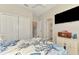 Cozy bedroom featuring a ceiling fan, closet, and an ensuite bathroom, offering convenience and comfort at 15033 Spanish Point Dr, Port Charlotte, FL 33981