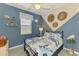 Charming bedroom with a coastal theme, decorative shelves, and a window providing natural light at 15033 Spanish Point Dr, Port Charlotte, FL 33981