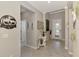 Inviting foyer with neutral walls, tile floors, and decorative accents create a warm welcome at 15033 Spanish Point Dr, Port Charlotte, FL 33981
