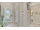 Open entryway with transom window over the front door, leading to other rooms in the house at 15033 Spanish Point Dr, Port Charlotte, FL 33981