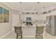 Bright kitchen with white cabinetry, granite countertops, stainless steel appliances, and a stylish backsplash at 15033 Spanish Point Dr, Port Charlotte, FL 33981