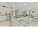 Gourmet kitchen with granite countertops, stainless steel appliances, and seamless flow to the dining and living areas at 15033 Spanish Point Dr, Port Charlotte, FL 33981