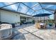 Enjoy this outdoor living space, screened-in lanai featuring a dining area and comfortable seating area at 15033 Spanish Point Dr, Port Charlotte, FL 33981