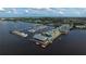 Stunning aerial view of the marina with colorful buildings and a multitude of boats docked on a sunny day at 197 Colony Point Dr, Punta Gorda, FL 33950