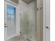 Modern bathroom with a glass-enclosed shower featuring marble tile and decorative accents at 197 Colony Point Dr, Punta Gorda, FL 33950