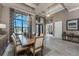 Open-concept dining space featuring a spacious table, designer lighting, and seamless flow to adjacent living areas at 197 Colony Point Dr, Punta Gorda, FL 33950