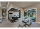 Contemporary dining area with view of the outdoor kitchen and swimming pool at 197 Colony Point Dr, Punta Gorda, FL 33950