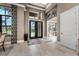 Grand entrance showcasing soaring ceilings, a stylish rug, and contemporary decor, creating a welcoming ambiance at 197 Colony Point Dr, Punta Gorda, FL 33950