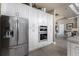 Gourmet kitchen with white cabinets, stainless appliances, and a seamless connection to the adjacent living spaces at 197 Colony Point Dr, Punta Gorda, FL 33950
