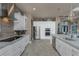 Well-equipped kitchen featuring stainless steel appliances, ample storage, and a view of the dining and living area at 197 Colony Point Dr, Punta Gorda, FL 33950