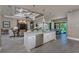 Bright, open kitchen with granite counters, stainless appliances, and view of the pool and dining area at 197 Colony Point Dr, Punta Gorda, FL 33950