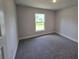 Bedroom with carpet, neutral walls and a window at 2201 Como St, Port Charlotte, FL 33948
