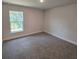 Bedroom with carpet and a window at 2201 Como St, Port Charlotte, FL 33948