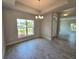 Dining area with large window offering natural light and tile floors at 2201 Como St, Port Charlotte, FL 33948