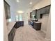 Stylish kitchen featuring dark cabinets, stainless steel appliances, and granite countertops at 2201 Como St, Port Charlotte, FL 33948