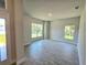 Bright living room featuring tile floors and large windows for natural light at 2201 Como St, Port Charlotte, FL 33948