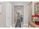 Home hallway featuring neutral paint and a tile floor, complemented by stylish decor at 2220 Darley Oak Way, North Port, FL 34289