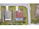Overhead aerial view of home with pool, landscaping and circular driveway at 23488 Almond Ave, Port Charlotte, FL 33954