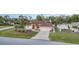 Charming single-story home features a well-maintained lawn, landscaping, and a two-car garage at 23488 Almond Ave, Port Charlotte, FL 33954