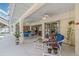 Covered lanai area with multiple seating areas and access to the pool at 23488 Almond Ave, Port Charlotte, FL 33954