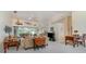 Bright living room featuring vaulted ceilings and sliding glass doors leading to outdoor area at 23488 Almond Ave, Port Charlotte, FL 33954