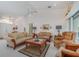 Elegant living room with traditional decor and ample seating, ideal for entertaining guests at 23488 Almond Ave, Port Charlotte, FL 33954