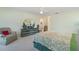 Another view of the spacious main bedroom shows carpet, ceiling fan, and furniture at 23488 Almond Ave, Port Charlotte, FL 33954