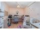 Home office featuring a ceiling fan, desk, and chair at 23488 Almond Ave, Port Charlotte, FL 33954