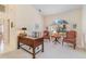 Sunlit office space with a large arched window, creating an ideal work-from-home setting at 23488 Almond Ave, Port Charlotte, FL 33954