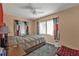 Neutral bedroom with ceiling fan, and natural light flooding through the windows at 2440 Ednor St, Port Charlotte, FL 33952