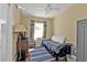 Cozy bedroom featuring a single bed, natural light, and laminate floors at 2440 Ednor St, Port Charlotte, FL 33952